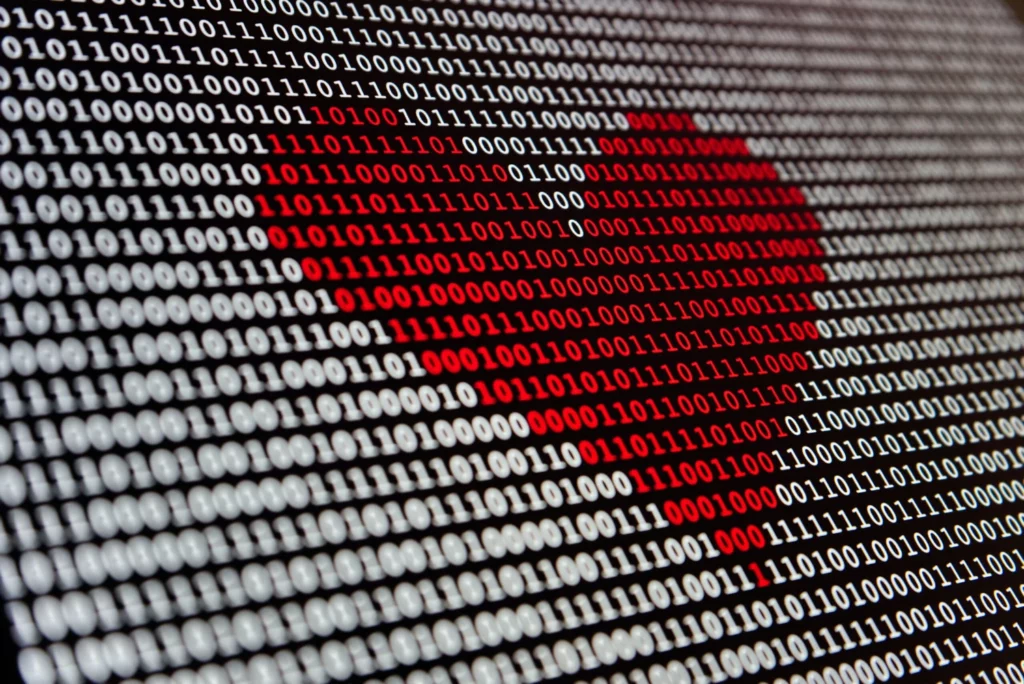 A heart made of binary code with red numbers
