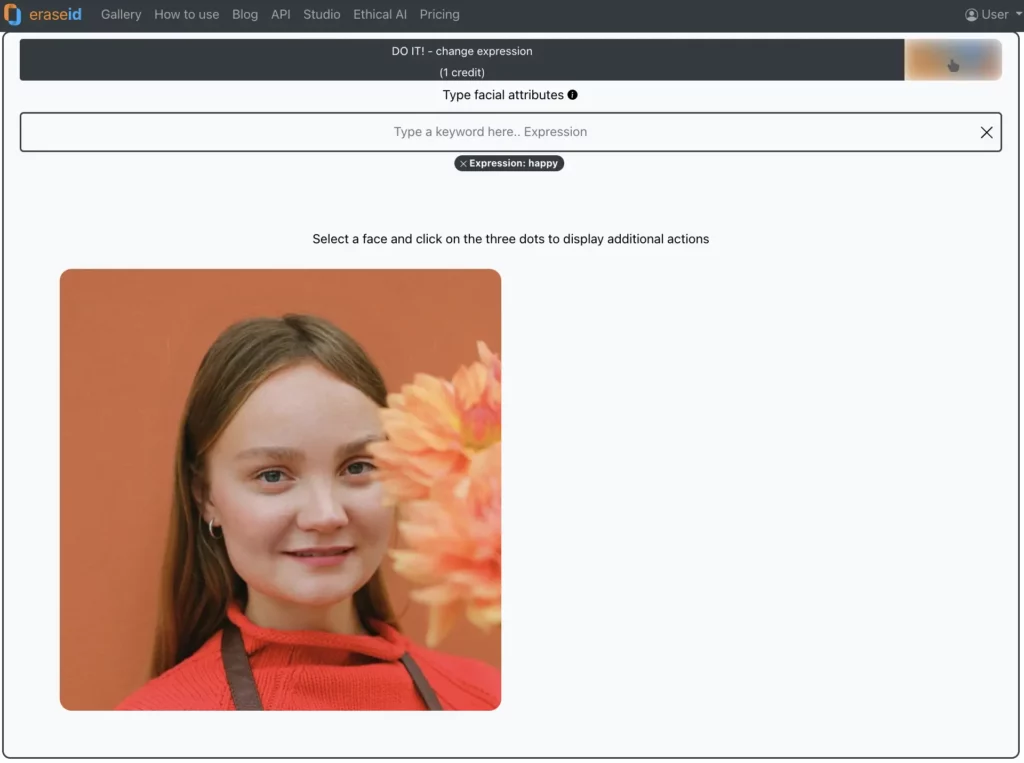 Smiling face of a woman in red shirt holding orange flowers