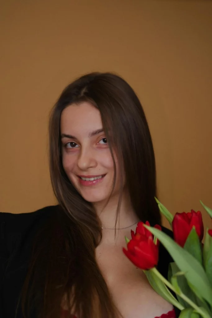 Happy image of a young girl holding flowers